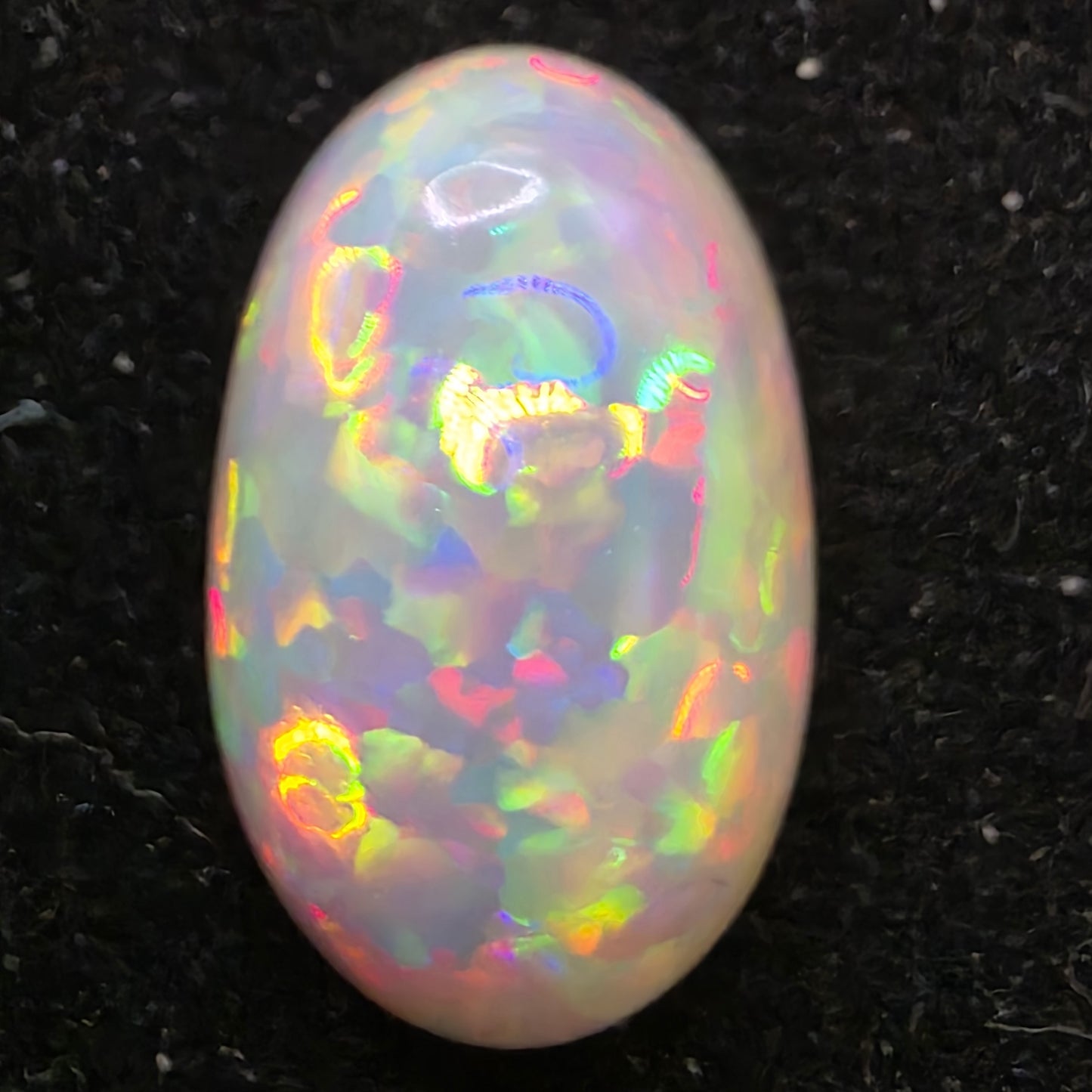 Black Opal special Ethiopian Welo, 6.55 ct oval polished, natural, intense Play-of-Colour