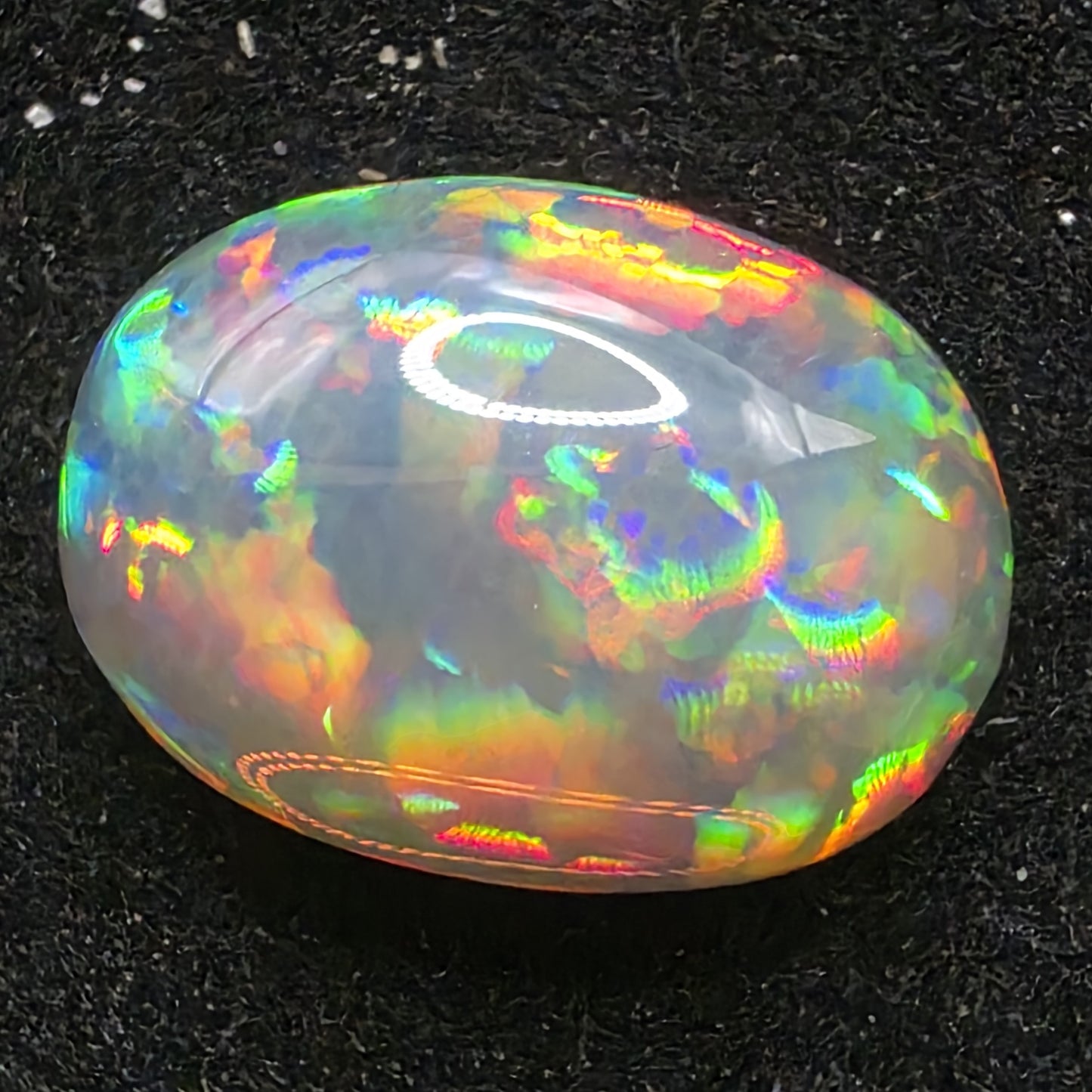 Black Opal special Ethiopian Welo, 5.4 ct oval polished, natural, intense Play-of-Colour