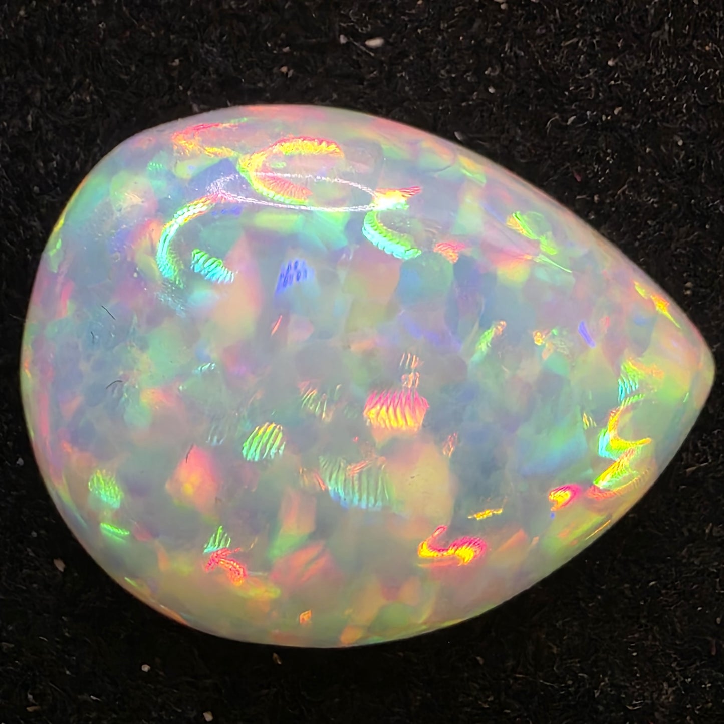 White Opal special Ethiopian Welo, 5.5 ct pear polished, natural, intense Play-of-Colour