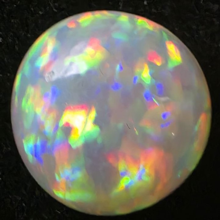 Black Opal special Ethiopian Welo, 5 ct round polished, natural, intense Play-of-Colour